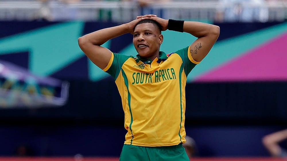 | Photo: AP/Adam Hunger : South Africa's Ottniel Baartman